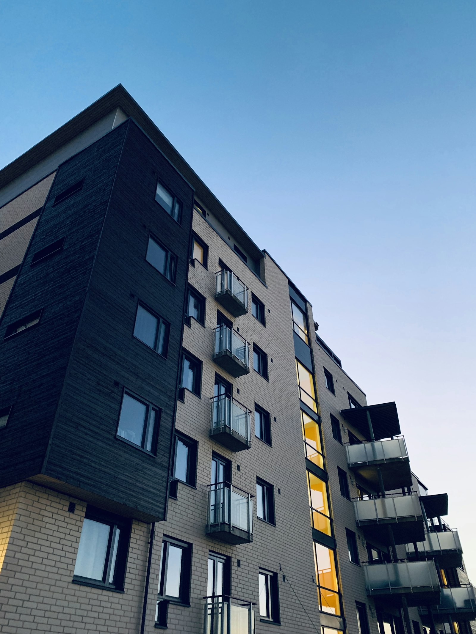 A modern residential apartment building managed by Pier Management